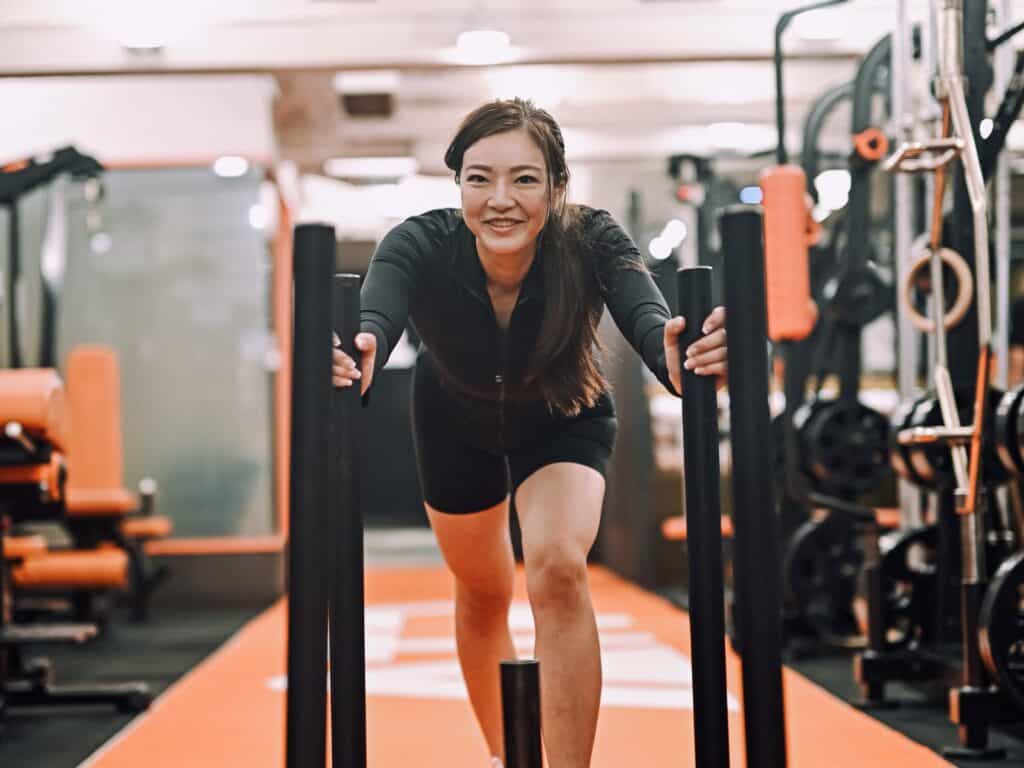 ATP Hong Kong client Wing Wing pushing a weighted sled