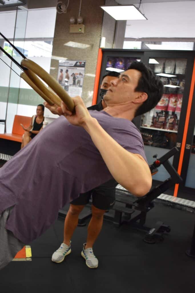 Jay Jenkins training on suspension rings at ATP Personal Training Singapore