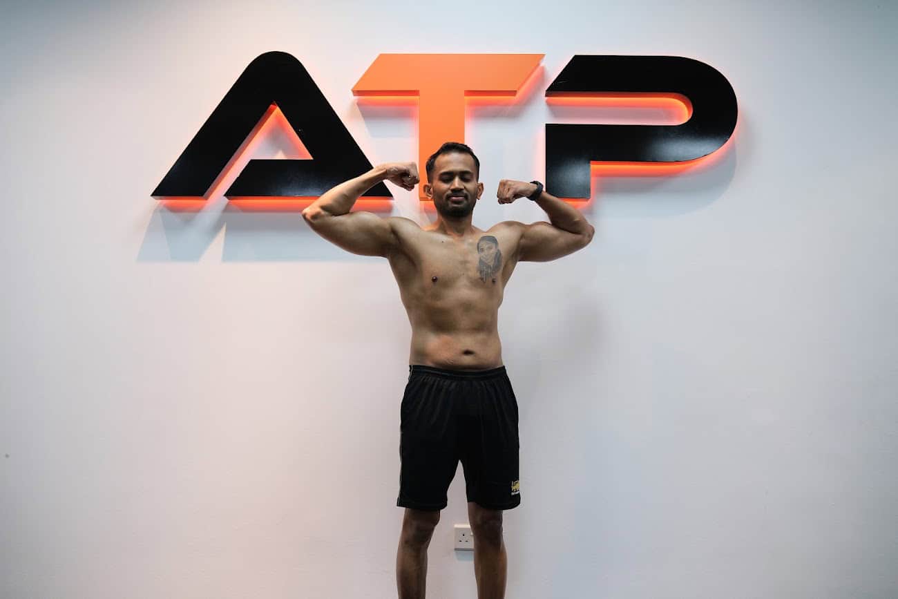 Kumanan showing his transformation result at ATP Personal Training Singapore