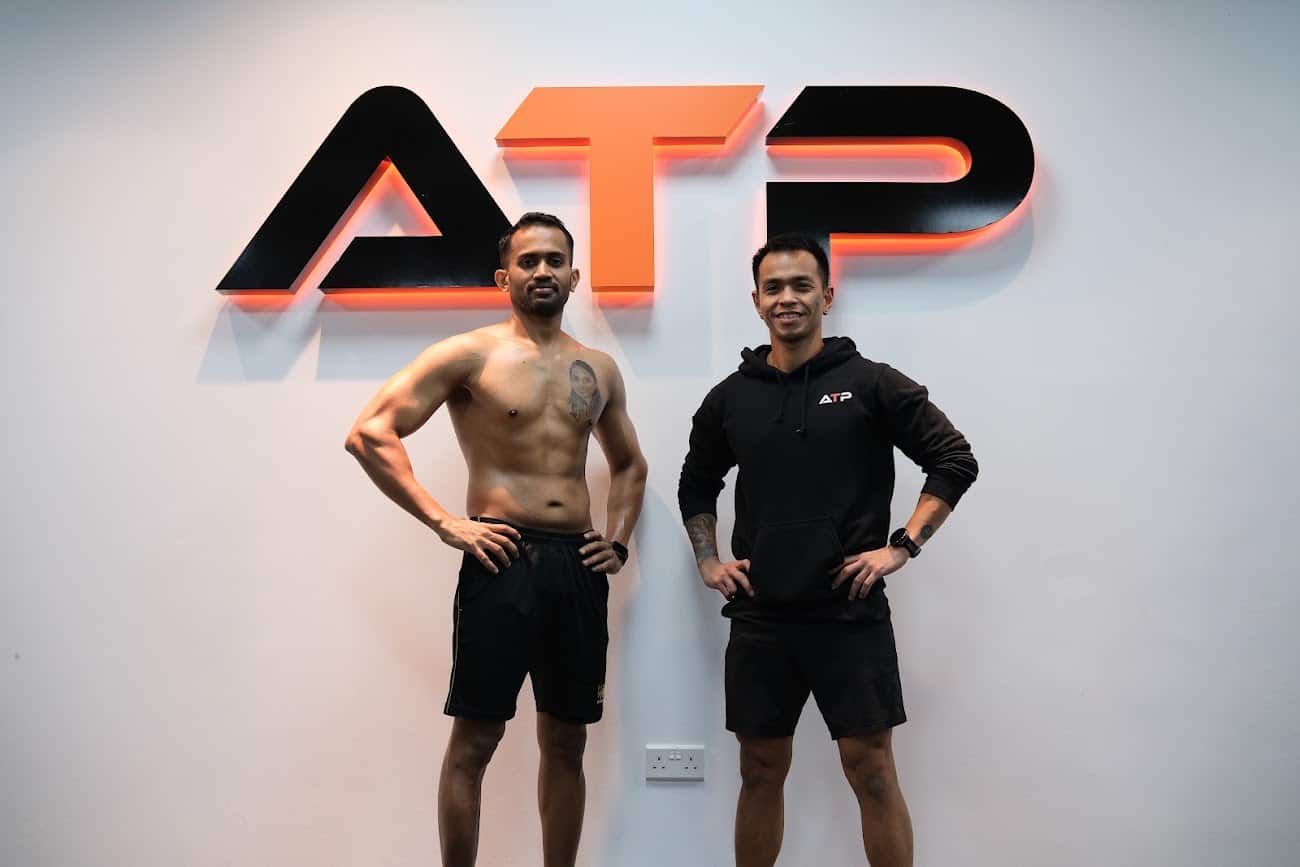Kumanan with his ATP personal trainer in Singapore