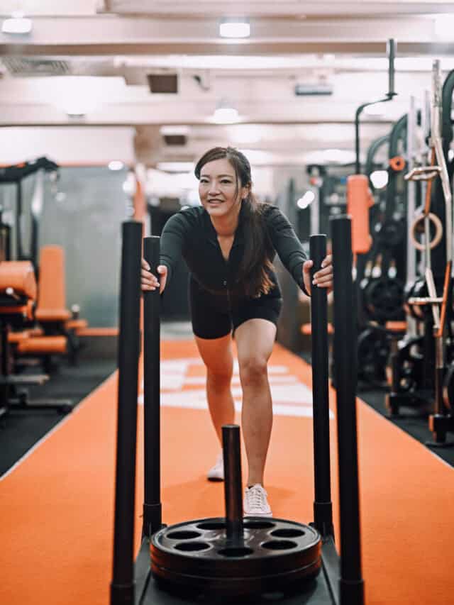 Wing Wing pushing a weighted sled at ATP Personal Training Hong Kong