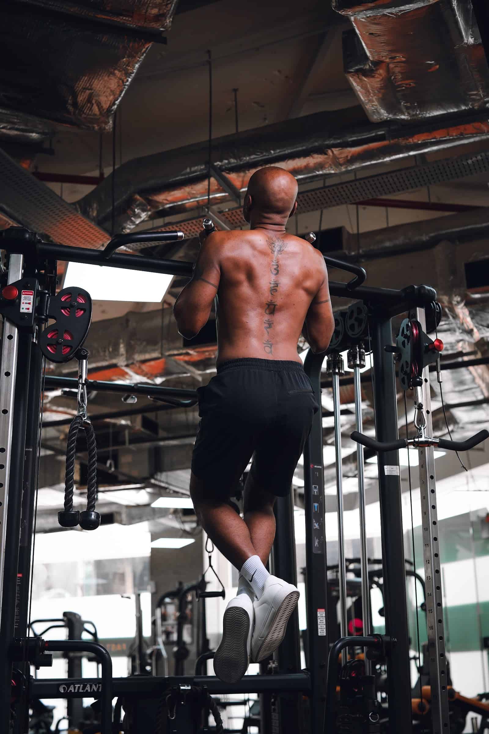 Vilvum performing chin-ups at ATP Personal Training Singapore