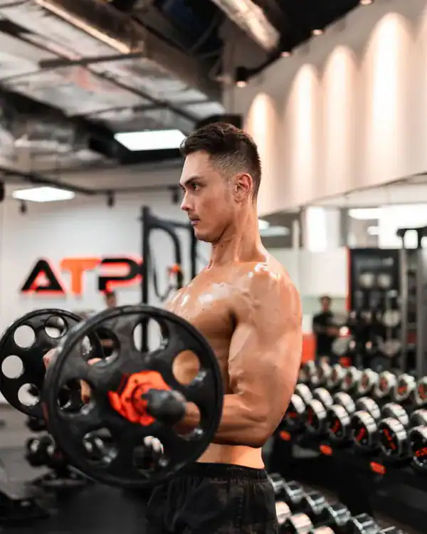 William doing a biceps curl at ATP Personal Training Singapore